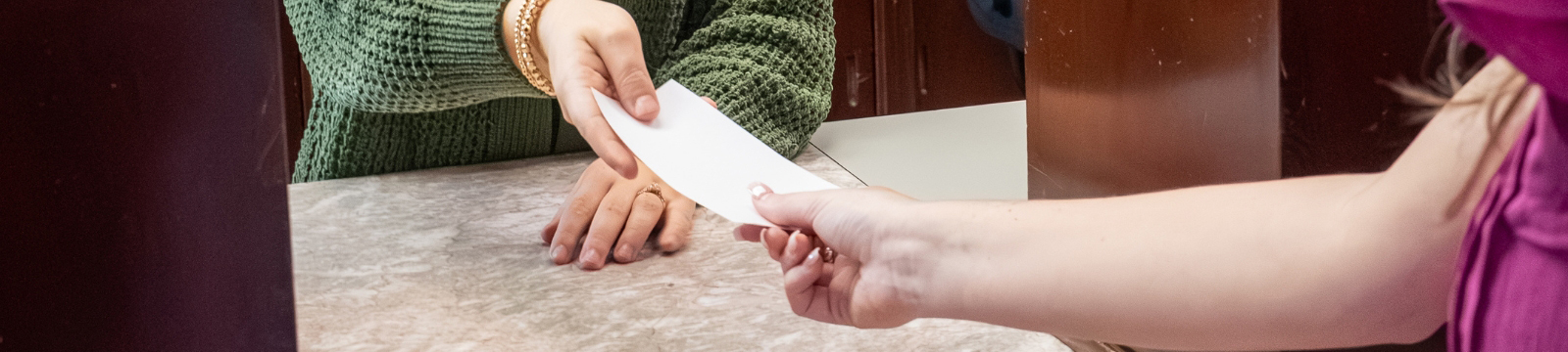 Teller handing out receipt
